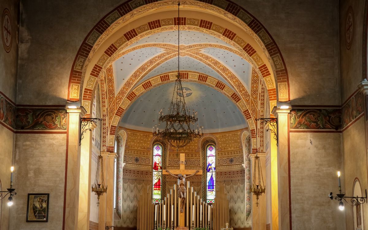 Stunning interior of traditional church in Spresiano, Italy with altar and frescoes.