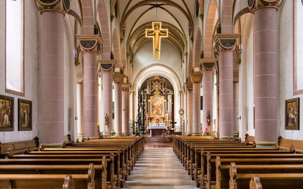 Wide interior view of a stunning empty Catholic church in Höxter, Germany.