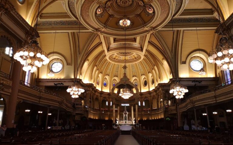 A stunning view of the ornate dome and interior of a Montreal cathedral, highlighting its architectural splendor.